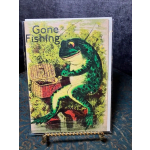 A greeting card with a cartoon frog and the words "Gone Fishing"