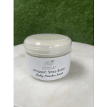 Jar of whipped shea butter with a white lid and label