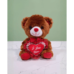 Brown teddy bear holding a red heart with "I Love You" text