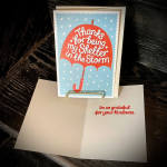 Greeting card with a red umbrella and thank-you message