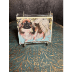 Decorative card with a painted dog illustration in a clear holder