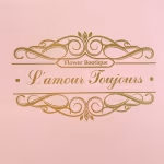 Pink gift card with gold decorative frame and script text