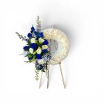 Blue and white floral standing wreath on a wooden easel