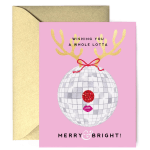 Pink holiday greeting card with disco ball reindeer ornament and gold envelope