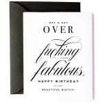 White birthday greeting card with bold black script text and black envelope
