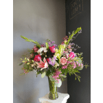 Mixed pink and white bouquet in a clear glass vase