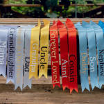 Colorful memorial ribbons with names printed on them