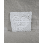 Gray stone sympathy plaque with heart-shaped inscription and carved flowers