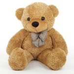 Teddy bear with a checkered bow tie