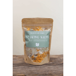 Bag of soaking salts with dried flowers in a kraft pouch