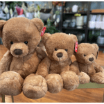 Set of three brown teddy bears in small, medium, and large sizes sitting in a row
