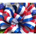 Red, white, and blue ribbon bows clustered together