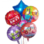 Cluster of colorful foil balloons with congratulatory messages
