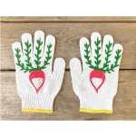 Pair of white knit gloves with green and red designs on a wooden surface