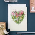 Greeting card with a heart-shaped floral bouquet illustration