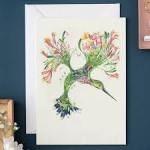 Greeting card with a colorful hummingbird and floral illustration