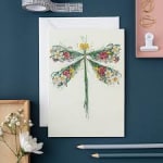 Floral dragonfly illustration on a white card