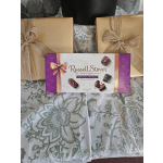 Gift boxes and a box of Russell Stover assorted caramels