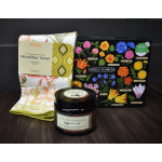 Gift set with a floral kitchen towel, edible flowers puzzle, and hand scrub jar