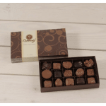 Box of assorted chocolates with the lid open beside it