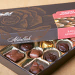 Box of assorted chocolates in gold paper cups