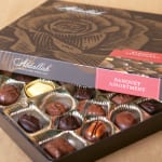 Box of assorted chocolates in gold paper cups