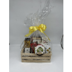 Gift basket of assorted snacks wrapped in clear cellophane with a yellow bow