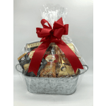 Gift basket of assorted snacks wrapped in clear cellophane with a red bow