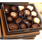 Box of assorted chocolates in paper cups