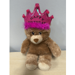 Teddy bear wearing a pink birthday crown