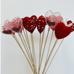 Heart-shaped decorative picks with red and pink accents on sticks