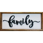 Framed wall sign with the word family in black script