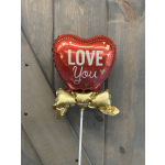 Heart-shaped red balloon with "LOVE You" text on a stick