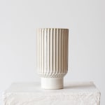 Tall ribbed ceramic vase in cream and beige tones