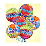 Cluster of colorful congratulatory balloons with printed messages