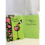Two green birthday cards with floral and wine-themed graphics