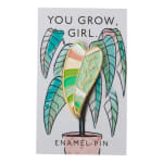 Enamel pin on a card with a potted plant illustration and the words "You grow, girl."