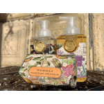 Three floral-patterned soap and lotion bottles with a boxed bar soap