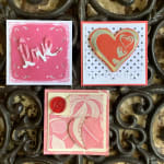 Three pink handmade greeting cards with heart and love designs