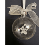 Clear glass ornament with a silver bow and white flower cutout