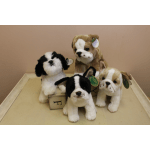 Four plush puppy figurines on a tray