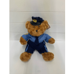 Teddy bear dressed in a blue firefighter uniform and hat