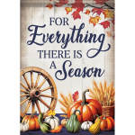 Fall sign with pumpkins, wheat, and a wagon wheel