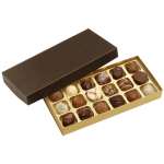 Rectangular box of assorted chocolates in a gold tray with a dark brown lid.