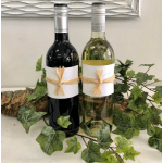 Two wine bottles tied with raffia and surrounded by ivy vines