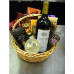 Gift basket with wine, crackers, cheese, and chocolates