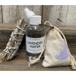 Lavender water bottle with a bundled sage stick and drawstring pouch