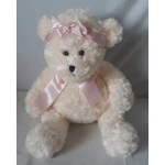 Cream teddy bear with a pink satin bow and ribbon