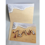 Two beach-themed thank-you cards with seashell letters on sand