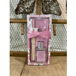 Pink boxed reed diffuser set with a ribbon and glass bottle